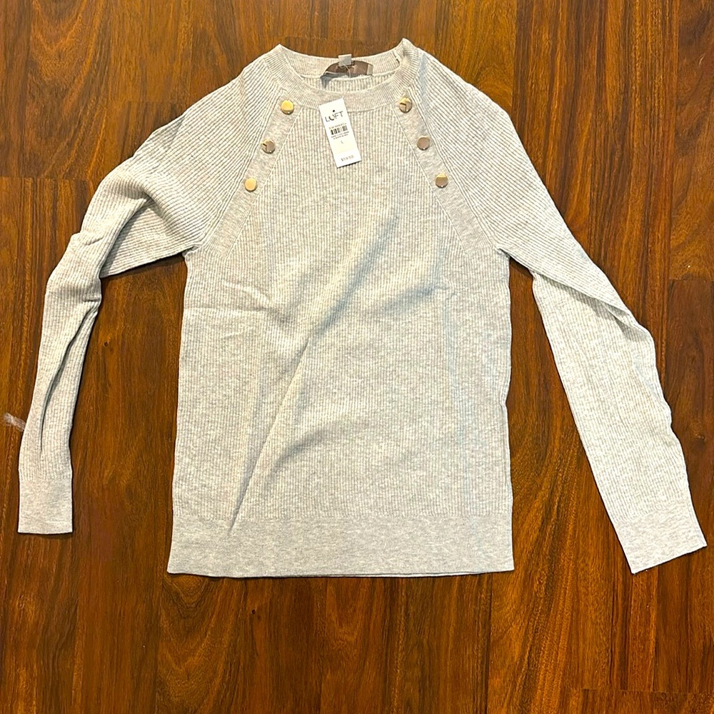 Women’s sweater with button detail